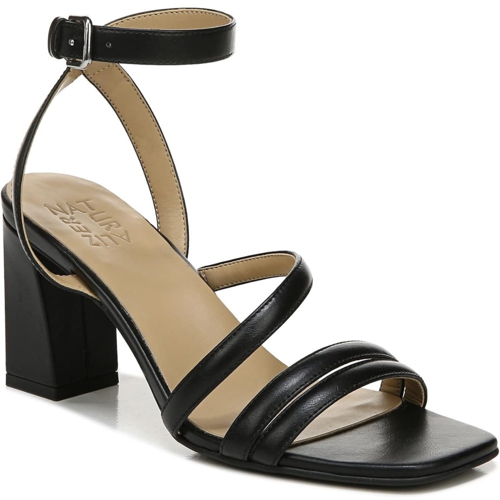 An asymmetrical strap and a block heel. Non-slip outsole.